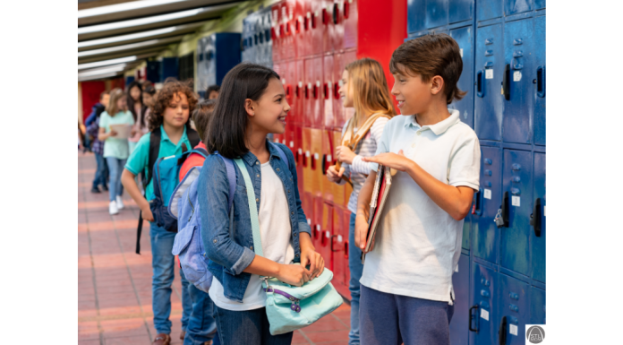 7 Things I Learned From Letting My 7th Grader Date a middle school aged girl and boy talking at school by their lockers