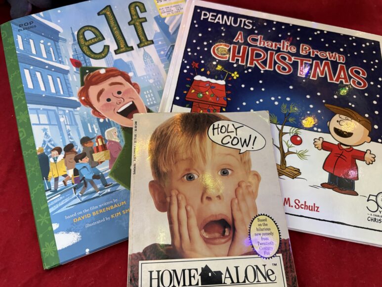 Image of the book versions of Elf, Home Alone and A Charlie Brown Christmas